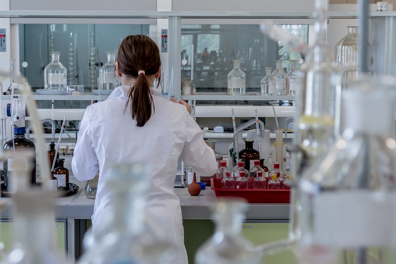 Medical researcher working in a laboratory surrounded by advanced testing equipment and chemical analysis tools, representing Medical business capital, institutional financing for hospitals, specialty hospital capital, healthcare technology upgrade financing, and hospital infrastructure loans used to support research facilities, healthcare innovation, laboratory modernization, and hospital expansion projects.