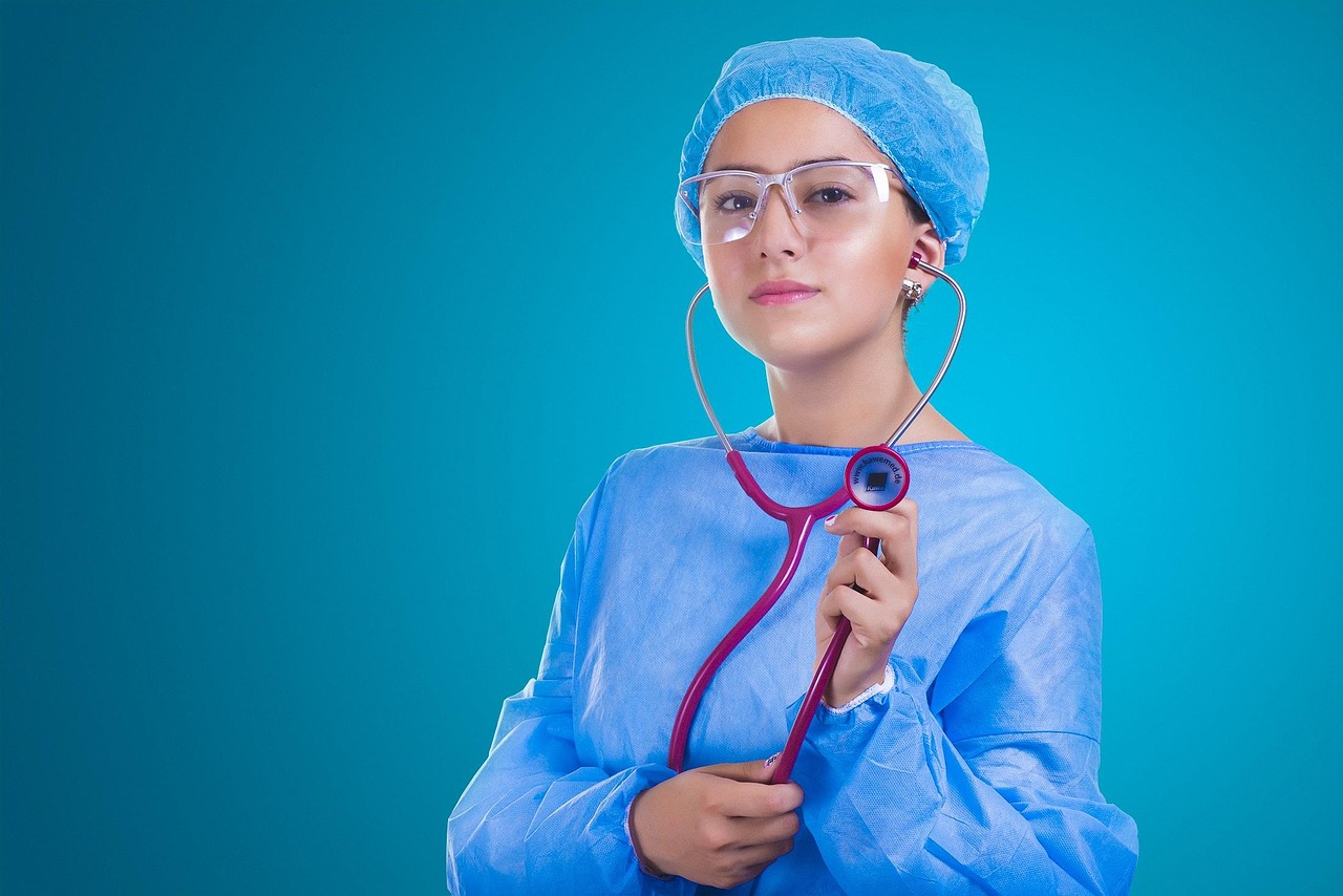 Healthcare professional in surgical attire holding a stethoscope, representing modern healthcare investment initiatives including hospital development loans, medical hardware leasing, clinical technology leasing, hospital automation financing, and cardiac hospital funding used to support advanced patient care, medical equipment acquisition, and hospital expansion projects.