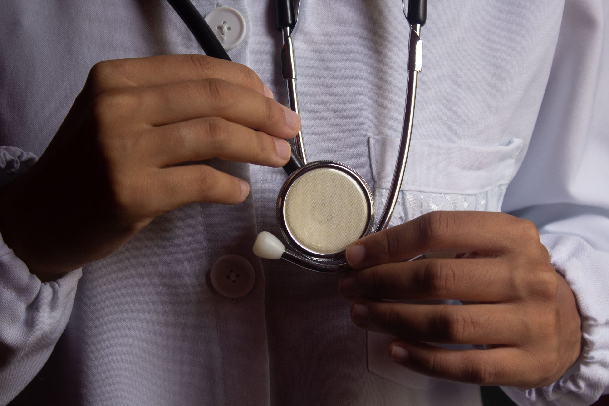 Close-up of a healthcare professional holding a stethoscope, representing Medical Practice Loans, Medical Equipment Leasing, Medical Practice Expansion Loans, Healthcare Working Capital Financing, and Doctor Office Building Financing solutions for physicians, clinics, and medical practices seeking growth capital and operational funding.