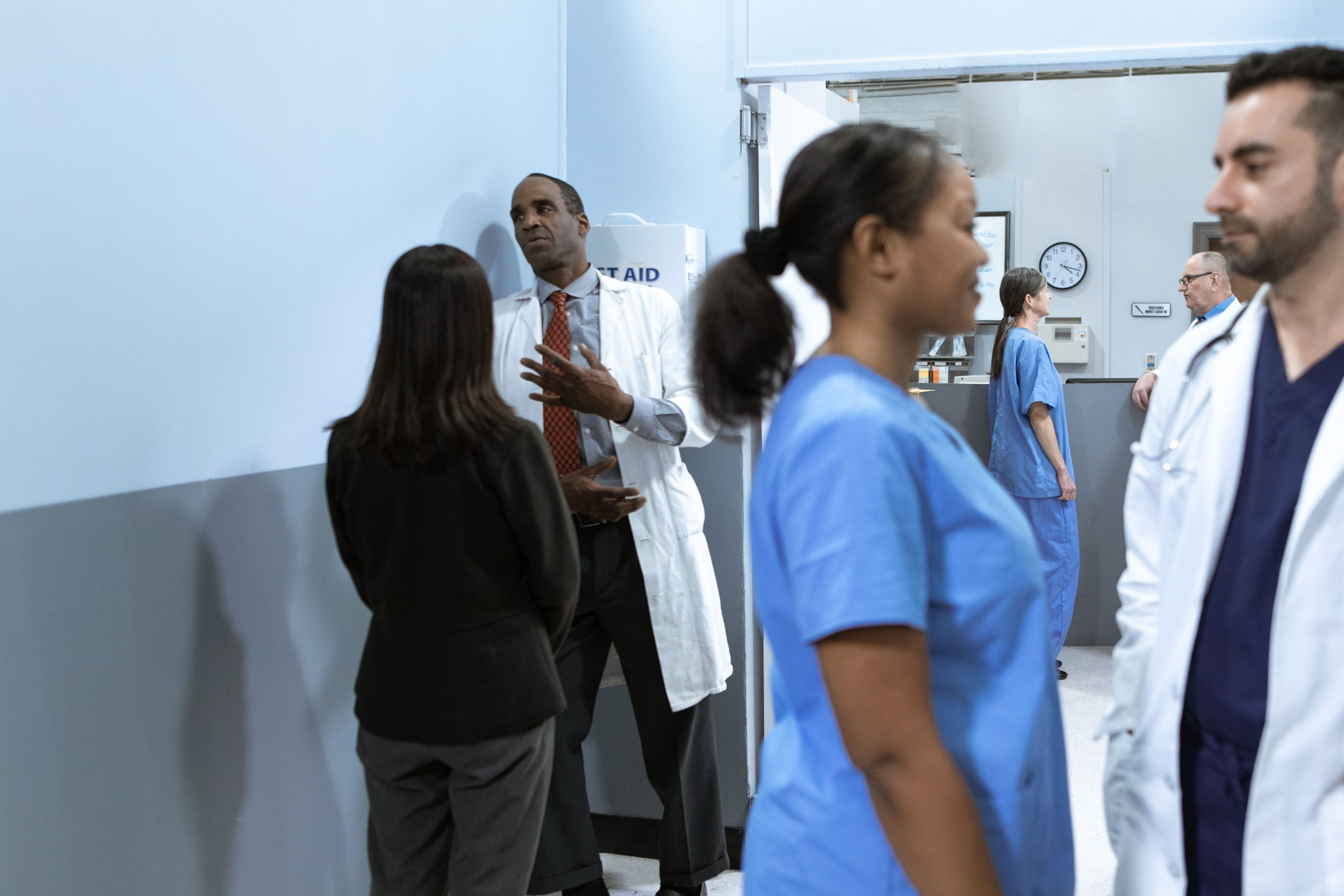 Hospital staff, physicians, nurses, and healthcare administrators collaborating inside a busy medical facility, representing hospital lending, healthcare accounts receivable funding, patient room upgrade financing, inpatient facility financing, and healthcare infrastructure capital used to support hospital expansion, modernization, staffing, and patient care improvements.